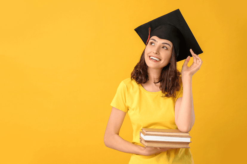 Student celebrating with graduation cap